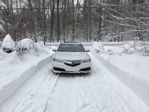 Acura telex AWD nella neve nell'inverno con le luci sopra immagine stock libera da diritti Acura telex AWD nella neve nell'inverno con le luci sopra immagine stock libera da diritti