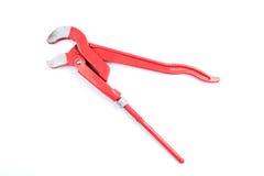 Adjustable red pipe wrench isolated on a white background, surface. Plumber`s working tool, equipment. Path saved stock photo Adjustable red pipe wrench isolated on a white background, surface. Plumber`s working tool, equipment. Path saved stock photo