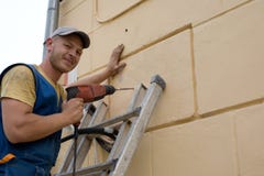 Adjuster works with a drill Stock Image Adjuster works with a drill Stock Image