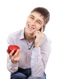 Adolescente con Apple y el teléfono móvil foto de archivo libre de regalías Adolescente con Apple y el teléfono móvil foto de archivo libre de regalías