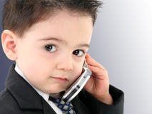 Adorable Baby Boy in Suit on Cellphone royalty free stock photography Adorable Baby Boy in Suit on Cellphone royalty free stock photography