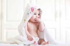 Adorable Baby Girl Sitting Under A Hooded Towel After Bath Stock Photography Adorable Baby Girl Sitting Under A Hooded Towel After Bath Stock Photography