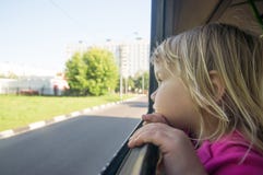 Adorable Baby Look At Window Riding On Bus Stock Photo