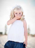 Adorable Blue Eyed Girl Covering Her Mouth stock photography Adorable Blue Eyed Girl Covering Her Mouth stock photography