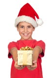 Adorable Child With Santa Hat Offering A Gift Royalty Free Stock Photography Adorable Child With Santa Hat Offering A Gift Royalty Free Stock Photography
