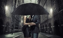 Adorable couple under the umbrella royalty free stock image Adorable couple under the umbrella royalty free stock image