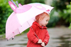 Adorable Girl At Rainy Day In Autumn Stock Photography