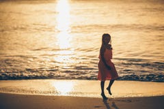 Adorable happy little girl on white beach at sunset. stock photography Adorable happy little girl on white beach at sunset. stock photography