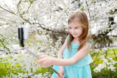 Adorable Little Girl Taking A Photo Of Herself Royalty Free Stock Images
