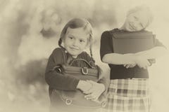 Two little girls ready back to school closeup, autumn day. stock photo Two little girls ready back to school closeup, autumn day. stock photo