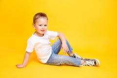 Adorable stylish girl posing on yellow background royalty free stock images Adorable stylish girl posing on yellow background royalty free stock images