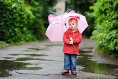 Adorable Toddler Girl At Rainy Day Stock Images