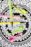 Art therapy, mental health, creativity and mindfulness concept. Adult coloring page with pastel colored gel pens, Flat lay. royalty free stock image Art therapy, mental health, creativity and mindfulness concept. Adult coloring page with pastel colored gel pens, Flat lay. royalty free stock image
