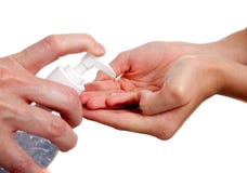 Adult giving child hand sanitizer