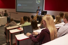 Adult student using laptop computer at a university lecture royalty free stock photography Adult student using laptop computer at a university lecture royalty free stock photography