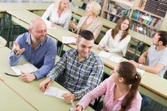 Adult students writing in classroom stock photography Adult students writing in classroom stock photography