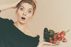 Woman with vegetables, shocked face expression Stock Photo Woman with vegetables, shocked face expression Stock Photo
