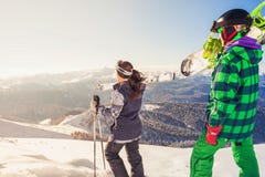 Adventure to winter sport. Skier and snowboarder hiking at mountain Stock Images Adventure to winter sport. Skier and snowboarder hiking at mountain Stock Images