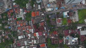 Aerial Birds Eye Overhead Top Down View of rooftops in urban residential neighborhood of Jakarta, Indonesia