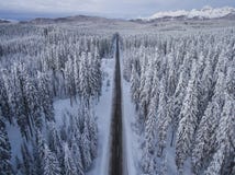 Aerial drone view of road in idyllic winter landscape. Street running through the nature from a birds eye view. royalty free stock images Aerial drone view of road in idyllic winter landscape. Street running through the nature from a birds eye view. royalty free stock images