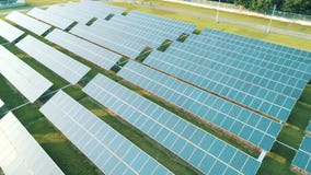 Aerial drone view of the solar panels in solar farm for green energy. Solar power plants. Renewable energy power plant