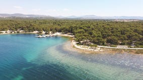 Drone image of St. Ante walkway, located in the dense pine forest on the shore of Adriatic sea at the city of Sibenik, Croatia