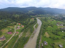 Aerial photo of river Prut. After a rainy day, taken in the Carpathian mountains, in the eastern Ukraine Stock Images Aerial photo of river Prut. After a rainy day, taken in the Carpathian mountains, in the eastern Ukraine Stock Images