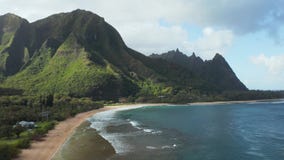 Aerial drone shot flying along the coast of tunnels beach on the north shore of Kauai in Hawaii