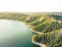 Aerial Trees And Cliff Rock Wall Crystal Water At Lake Travis, A Stock Photo