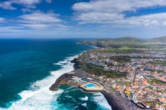 Aerial view of Atlantic coast at Ribeira Grande. Blue water and clouds. Island of Sao Miguel, Azores Islands, Portugal, Europe