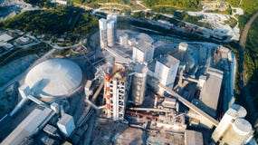 Aerial view of cement manufacturing plant. Concept of buildings at the factory, steel pipes, giants. stock photography Aerial view of cement manufacturing plant. Concept of buildings at the factory, steel pipes, giants. stock photography