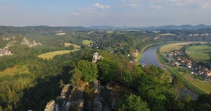 Aerial view a magnificent panoramic view of Bastai in Germany next to the river on a sunny day. stock video Aerial view a magnificent panoramic view of Bastai in Germany next to the river on a sunny day. stock video