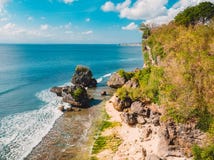 Aerial view of sandy beach with ocean and rocks at Padang Padang, Bali. Stock Image Aerial view of sandy beach with ocean and rocks at Padang Padang, Bali. Stock Image