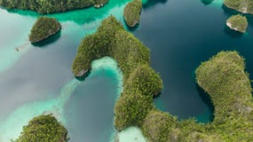 Aerial View Of Triton Bay In Raja Ampat Islands: Lagoon With Turquoise Water And Green Tropical Trees. Wide Angle Nature