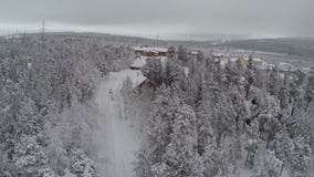 Aerial view of winter camp in pine forest
