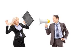 An afraid businesswoman and her manager shouting with a speakerphone royalty free stock images An afraid businesswoman and her manager shouting with a speakerphone royalty free stock images