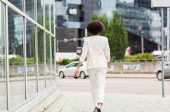 African american businesswoman walking in city Royalty Free Stock Photo African american businesswoman walking in city Royalty Free Stock Photo
