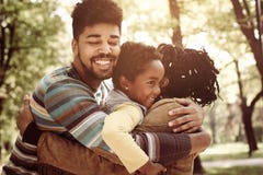 African American family hugging in park. royalty free stock photos African American family hugging in park. royalty free stock photos