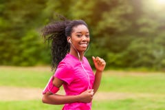 African american woman runner jogging outdoors - Fitness, peopl royalty free stock photography African american woman runner jogging outdoors - Fitness, peopl royalty free stock photography