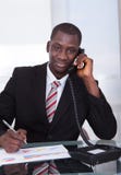 African businessman talking on telephone Stock Image African businessman talking on telephone Stock Image