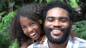 African Father and Daughter Laughing