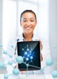 African female doctor with tablet pc and molecules stock image African female doctor with tablet pc and molecules stock image