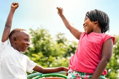 African kids looking at each other raising hands. stock photo African kids looking at each other raising hands. stock photo