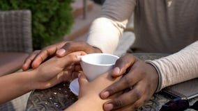African man holding girlfriend hands, romantic date in cafe, love expression royalty free stock photography African man holding girlfriend hands, romantic date in cafe, love expression royalty free stock photography