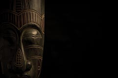 African mask over black background stock image African mask over black background stock image