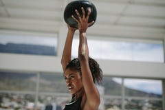 African woman training with fitness ball stock photo African woman training with fitness ball stock photo