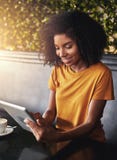An african young woman using digital tablet in cafe royalty free stock photo An african young woman using digital tablet in cafe royalty free stock photo