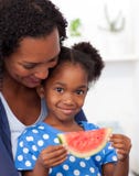 Afro-american girl eating watermelon royalty free stock photos Afro-american girl eating watermelon royalty free stock photos