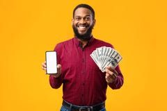Afro Guy Holding Mobile Phone And Bunch Of Money Cash Royalty Free Stock Image Afro Guy Holding Mobile Phone And Bunch Of Money Cash Royalty Free Stock Image