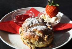 Afternoon cream tea / english scone, jam, clotted cream royalty free stock photography Afternoon cream tea / english scone, jam, clotted cream royalty free stock photography